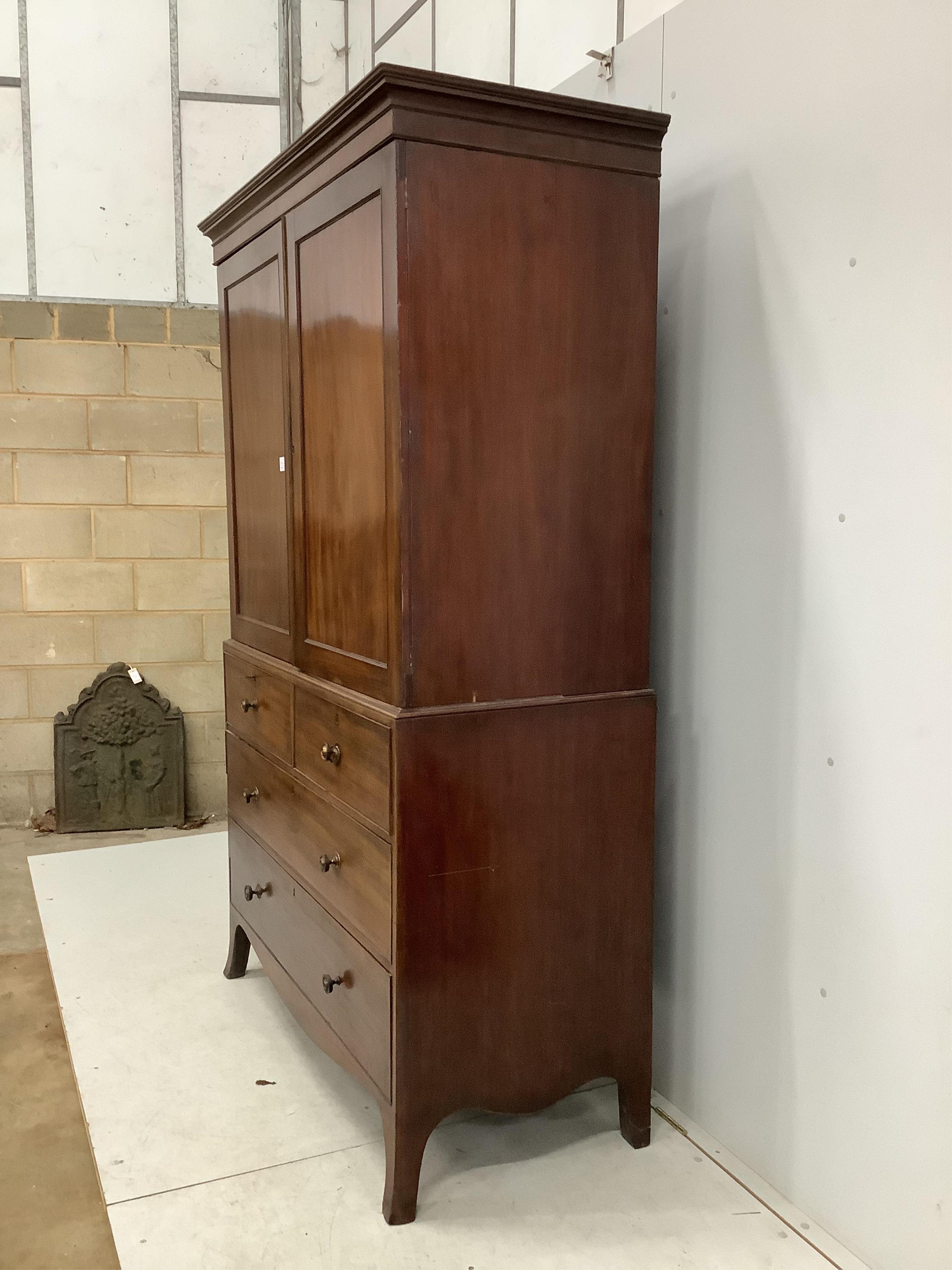 A George IV mahogany linen press, width 128cm, depth 58cm, height 208cm. Condition - fair, interior adapted